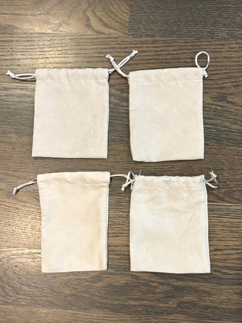 Kendra Scott Light Beige Drawstring Jewelry Pouches with Gold Logo - Set of 4